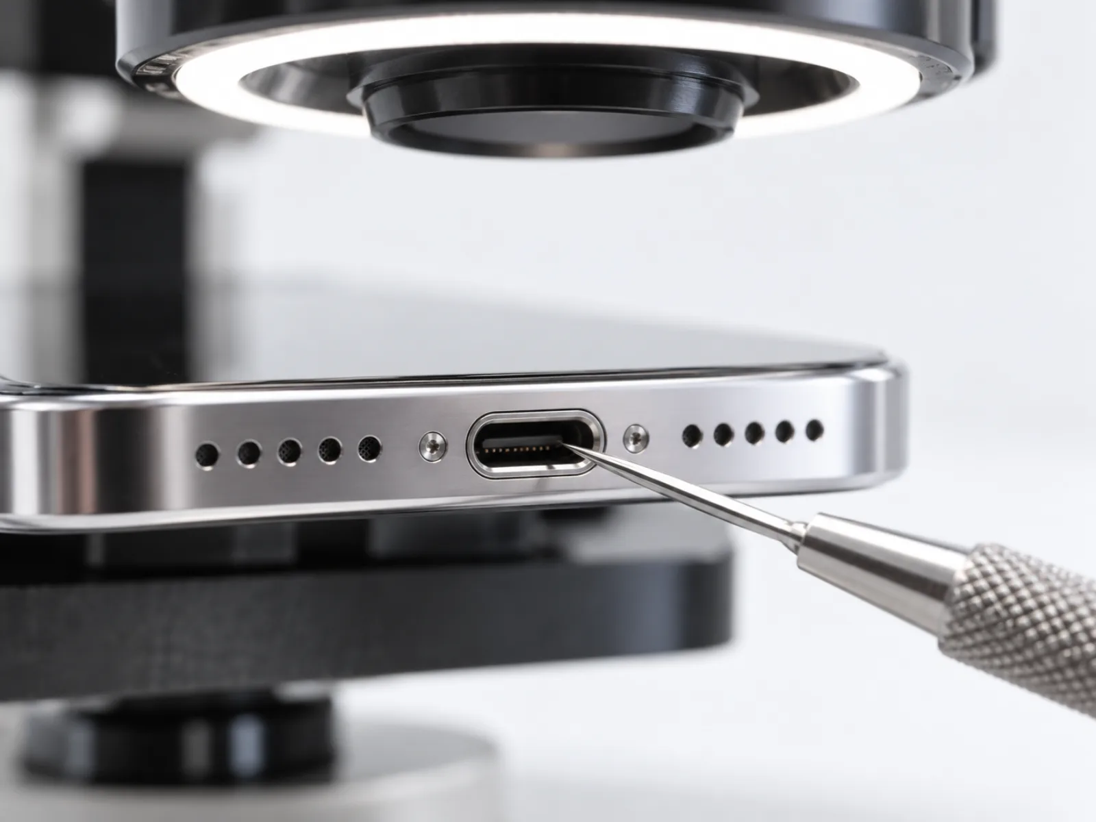 Huawei Honor 9 Lite charging port checked under a microscope